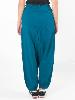 Pantalon sarouel slim bleu pétrole à découpes asymétriques